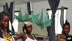 Pregnant women wait to give birth in the prenatal ward at Princess Christian Maternity Hospital in Freetown, Sierra Leone. Improving maternal health is one of the Millennium Development Goals. (2010 file photo)