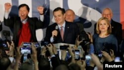 U.S. Republican presidential candidate Ted Cruz speaks, with his wife, Heidi Cruz, by his side, after winning at his Iowa caucus night rally in Des Moines, Iowa, United States, Feb. 1, 2016. 