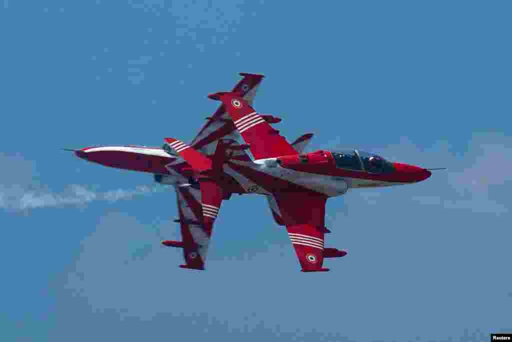 The Surya Kiran Aerobatic Team (SKAT) from the Indian Air Force (IAF) performs during a rehearsal ahead of the Royal Thai Air Force 88th Anniversary at Wing 6 Royal Thai Air Force, in Bangkok, Thailand.