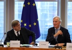 The European Union's Chief Brexit Negotiator Michel Barnier, right, and Guy Verhofstadt, the European Parliament’s Brexit steering group coordinator, attend a Brexit meeting at the European Parliament in Brussels, Belgium, Oct. 2, 2019.