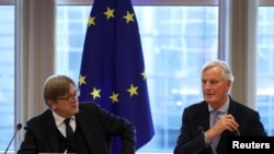 The European Union's Chief Brexit Negotiator Michel Barnier, right, and Guy Verhofstadt, the European Parliament’s Brexit steering group coordinator, attend a Brexit meeting at the European Parliament in Brussels, Belgium, Oct. 2, 2019.