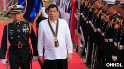 Philippine President Rodrigo Duterte reviews honor guards upon his arrival during the Philippine Navy's 120th anniversary in Metro Manila, Philippines, May 22, 2018.