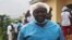 Le docteur Georges Bwelle, chef du service de chirurgie viscérale de l'hôpital central de Yaoundé, pose pour un portrait devant la prison de Nkongsamba à Nkongsamba, Cameroun, le 17 juillet 2021.