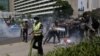 FILE - Police clash with protesters who gathered to rally against Indonesia's rule over the remote eastern Indonesian province of Papua, Dec. 1, 2015.