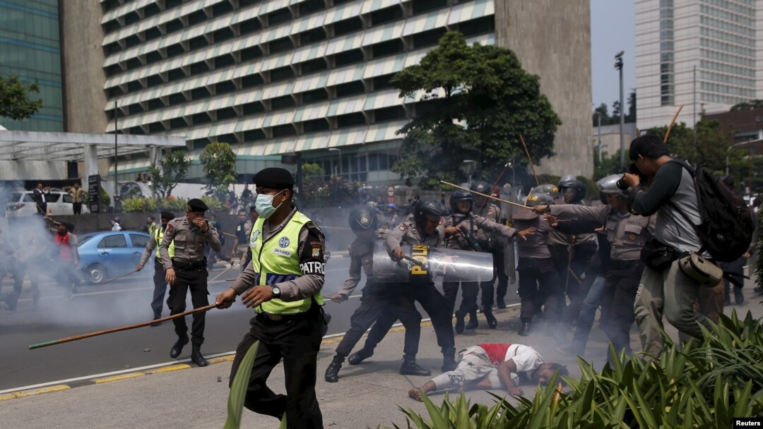 FILE - Police clash with protesters who gathered to rally against Indonesia's rule over the remote eastern Indonesian province of Papua, Dec. 1, 2015. Protesters and police faced off in Jakarta this year.