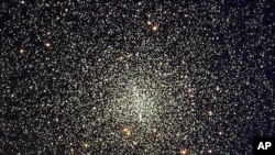 NASA's Hubble Space Telescope has uncovered the oldest burned-out stars, white dwarfs, estimated to be between 12 and 13 billion years old, inside this star cluster located 7,000 light-years away, as seen in this handout photo, date not known. 