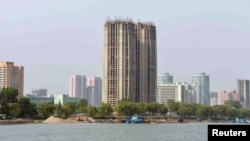 FILE - View from the Taedong River of the construction of apartment buildings for faculty members of Kim Ch'aek University of Technology in this undated photo released by North Korea's Korean Central News Agency (KCNA) in Pyongyang, May 21, 2014. 