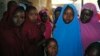 Aishat Alhaji, second from right, one of the girls abducted in February from a boarding school, is photographed after her release, in Dapchi, Nigeria, March 21, 2018.