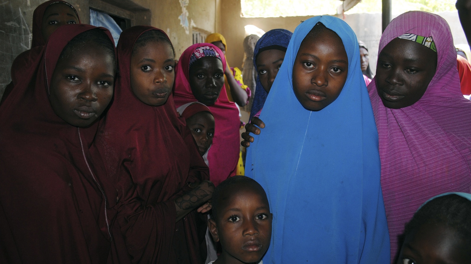Aishat Alhaji, second from right, one of the girls abducted in February from a boarding school, is photographed after her release, in Dapchi, Nigeria, March 21, 2018.