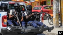 FILE - Police patrol Port-au-Prince, Haiti, Jan. 31, 2023.