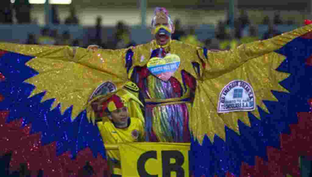 Colombia's fan known as "El Cole" cheers prior to a U-20 World Cup group A soccer match against Mali in Bogota, Colombia, Tuesday, Aug. 2, 2011. (AP Photo/William Fernando Martinez)