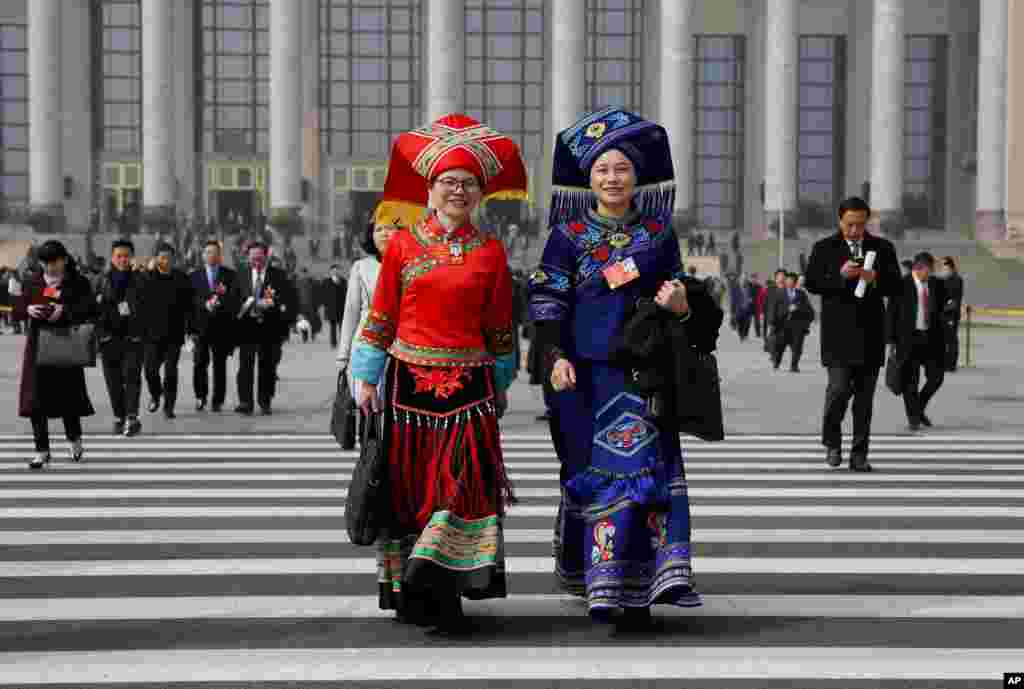 Delegates leave after attending a plenary session of China&#39;s National People&#39;s Congress (NPC) at the Great Hall of People in Beijing.