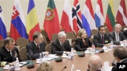 US Defense Secretary Robert Gates, Secretary of State Hillary Clinton (both center), at NATO Headquarters in Brussels 14 Oct 2010