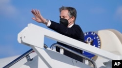 FILE - U.S. Secretary of State Antony Blinken waves as he departs for a foreign trip, at Andrews Air Force Base, Maryland, Jan. 18, 2022.
