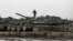 FILE - Israeli Merkava battle tanks are stationed during a military drill in the Israel-annexed Golan Heights, Jan. 31, 2022. 
