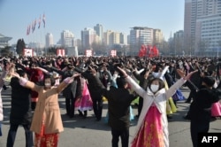 Youths and students dance as they celebrate the 74th founding anniversary of the Korean People's Army in Pyongyang, Feb. 8, 2022.