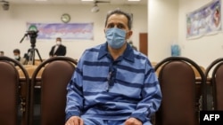 FILE - Jamshid Sharmahd attends the first hearing of his trial in Tehran, Iran, on Feb. 6, 2022. Iran said on Oct. 28, 2024, that it executed Sharmahd, but an Iranian official said on Nov. 5 that the prisoner died before he could be executed. (Mizan News Agency via AFP)