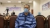 Jamshid Sharmahd attends the first hearing of his trial in Tehran on Feb. 6, 2022. (Photo by Koosha MAHSHID FALAHI / MIZAN NEWS AGENCY / AFP)
