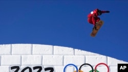 Canada's Darcy Sharpe competes during the men's slopestyle qualifying at the 2022 Winter Olympics, Feb. 6, 2022, in Zhangjiakou, China.