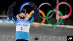 Jonna Sundling of Sweden celebrates after winning the gold medal in the women's sprint free cross-country skiing competition, Feb. 8, 2022.