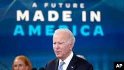 President Joe Biden speaks about domestic manufacturing and electric vehicle chargers while accompanied by Tritium CEO Jane Hunter in the South Court Auditorium in the Eisenhower Executive Office Building on the White House complex, Feb. 8, 2022.