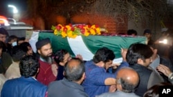 Relatives, friends carry the body of a Pakistani soldier killed in a gun battle with militants in country’s volatile southwestern Baluchistan province; Faisalabad, Pakistan, Feb. 3, 2022.