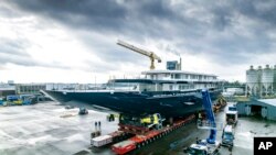 FILE - A view of a yacht, reportedly being built for Amazon founder Jeff Bezos, on the wharf in Zwijndrecht, near Rotterdam, Netherlands, Oct. 21, 2021.
