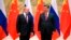 Chủ tịch Trung Quốc Tập Cận Bình (phải) và Tổng thống Nga Vladimir Putin trước cuộc hội kiến của họ ở Bắc Kinh, Trung Quốc, ngày 4 tháng 2, 2022.