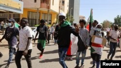 Protesters take part in a march against the military rule in Khartoum, Sudan Feb. 7, 2022. 