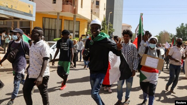 FILE - Protesters take part in a march against the military rule in Khartoum, Sudan Feb. 7, 2022.
