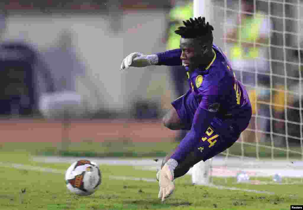 Cameroon&#39;s Andre Onana saves a penalty from Burkina Faso&#39;s Blati Toure in the shoot-out, Feb. 5, 2022.