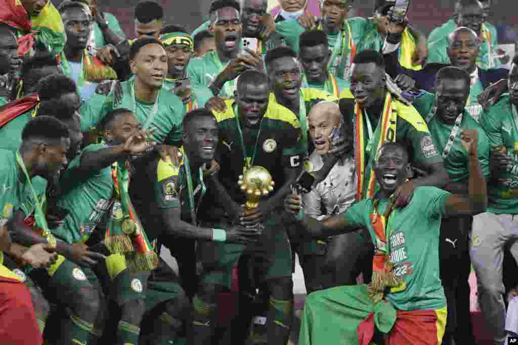 Senegal&#39;s players celebrate after winning the final soccer match against Egypt, Feb. 6, 2022.