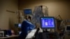 Medical staff treat a COVID-19 patient in the Intensive Care Unit at the Providence Mission Hospital in Mission Viejo, California, Jan. 25, 2022.