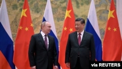 Russian President Vladimir Putin attends a meeting with Chinese President Xi Jinping in Beijing, China, Feb. 4, 2022. (Sputnik/Aleksey Druzhinin/Kremlin via Reuters)