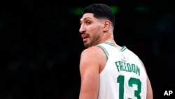 FILE - Boston Celtics center Enes Kanter Freedom looks toward the team's bench during the first half of an NBA basketball game Dec. 1, 2021, in Boston.
