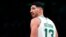 FILE - Boston Celtics center Enes Kanter Freedom looks toward the team's bench during the first half of an NBA basketball game Dec. 1, 2021, in Boston.