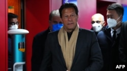 FILE - Pakistan's Prime Minister Imran Khan arrives at the National Stadium, known as the Bird's Nest, in Beijing, for the opening ceremony of the Beijing 2022 Winter Olympic Games, Feb. 4, 2022. 