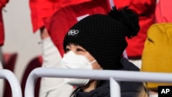 China's Peng Shuai watches the women's freestyle skiing big air finals at the 2022 Winter Olympics, Feb. 8, 2022, in Beijing.