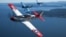 Air National Guard and the Heritage Flight Museum's P-51 Mustang flies over Seattle, Wash., July 30, 2015.