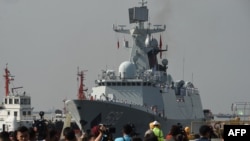 Journalists wait for the arrival of Chinese guided-missile frigate Wuhu at the international port in Manila on Jan. 17, 2019.