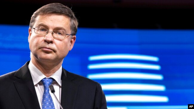 FILE - EU Trade Commissioner Valdis Dombrovskis speaks during a press conference in Brussels, on Dec. 7, 2021.