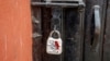 FILE - A sealed lock hangs at the gate of the closed Kashmir Press Club building in Srinagar, Indian-controlled Kashmir, Jan. 18, 2022. 
