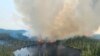 FILE - In this image released by the Ontario Ministry of Natural Resources and Forestry, the Chapleau 3 wildfire burns near the township of Chapleau, Ontario, on Sunday, June 4, 2023. 