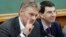 FILE - Kremlin spokesman Dmitry Peskov (L) is seen speaking during a meeting in Moscow, Russia.