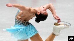 FILE - Alysa Liu, of the United States, performs during the women's free skating at the ISU Grand Prix of Figure Skating NHK Trophy competition in Tokyo, Japan, Nov. 13, 2021. 