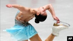 FILE - Alysa Liu, of the United States, performs during the women's free skating at the ISU Grand Prix of Figure Skating NHK Trophy competition in Tokyo, Japan, Nov. 13, 2021. 