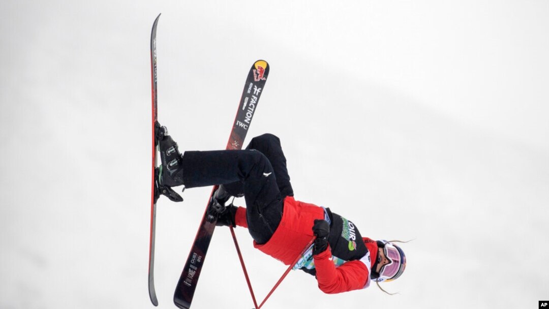 FILE- Eileen Gu, of China, makes a run in the slopestyle finals, Dec. 17, 2021, during the Dew Tour freestyle skiing event at Copper Mountain, Colo.