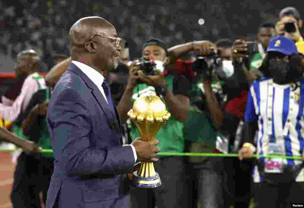 Former Cameroon player and soccer legend Roger Milla with the Africa Cup of Nations trophy after the match Senegal vs Egypt in Cameroon, Feb. 6, 2022.