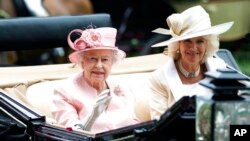 FILE - Britain's Queen Elizabeth II with Camilla, Duchess of Cornwall, arrive at the Royal Ascot horse race, Ascot, England, June 18, 2013.