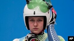 Elsa Desmond, of Ireland, prepares to start for the luge women's singles run 1 at the 2022 Winter Olympics, Monday, Feb. 7, 2022, in the Yanqing district of Beijing.(AP Photo/Mark Schiefelbein)